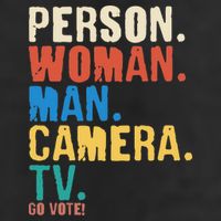 Person Woman Man Camera TV Go Vote Distressed 7 Panel Mesh Trucker Snapback Hat
