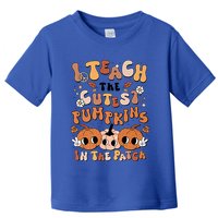 Retro Fall Halloween I Teach The Cutest Pumpkin In The Patch Gift Toddler T-Shirt