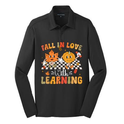 Retro Fall In Love With Learning Autumn Pumpkin Teacher Silk Touch Performance Long Sleeve Polo