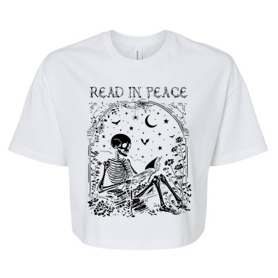 Read In Peace Skeleton Reading Teacher Spooky Halloween Bella+Canvas Jersey Crop Tee