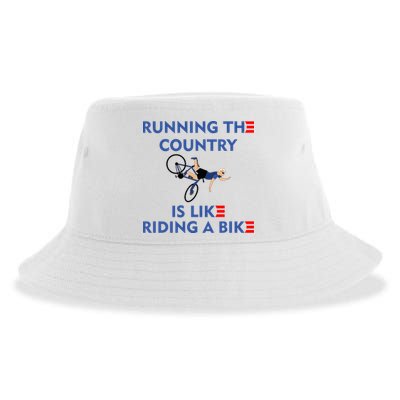 Running The Country Is Like Riding A Bike Biden Falling Meme Sustainable Bucket Hat