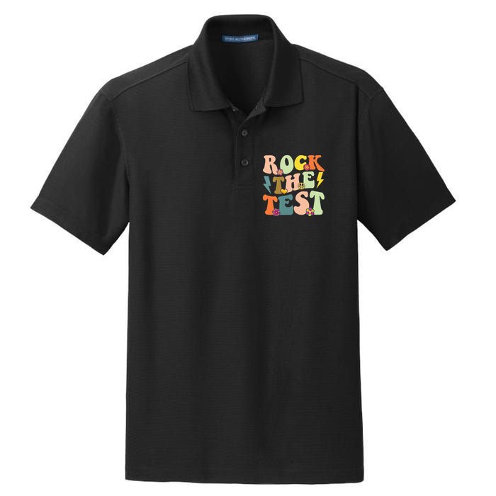 Rock The Test Groovy Design Funny Testing Day Teacher Dry Zone Grid Polo