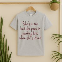 Shes A Ten But She Pees In Parking Lots When Shes Drunk T-Shirt