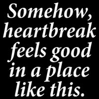 Somehow Heartbreak Feels Good In A Place Like This Flexfit Unipanel Trucker Cap
