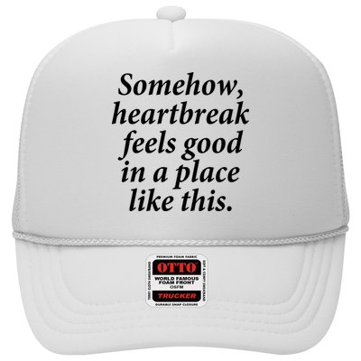 Somehow Heartbreak Feels Good In A Place Like This Trucker Hat