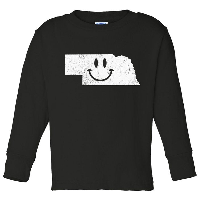 Smiling In NE – Funny Nebraska Happy Face Toddler Long Sleeve Shirt