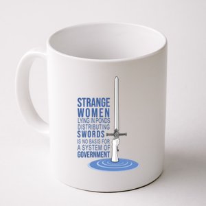 Strange Women Lying In Ponds Distributing Swords Coffee Mug