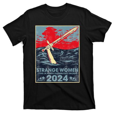 Strange Women Lying In Ponds Distributing Swords 2024 T-Shirt