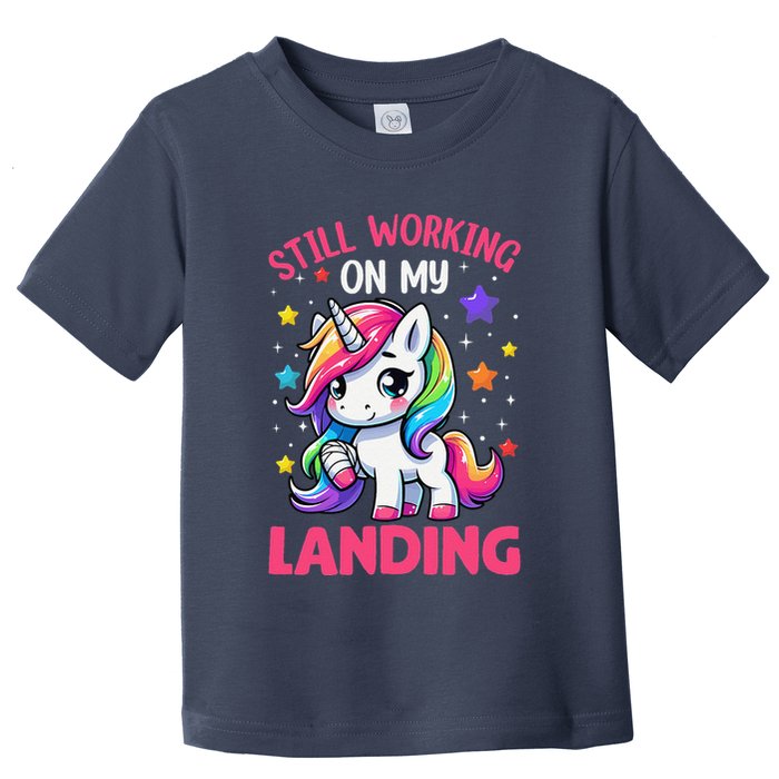 Still Working On My Landing Injury Broken Arm Cute Unicorn Toddler T-Shirt