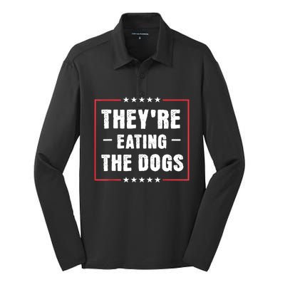 They Are Eating The Dogs Silk Touch Performance Long Sleeve Polo