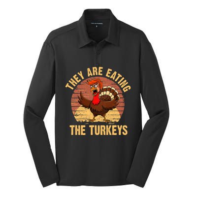 They Are Eating The Turkeys Thanksgiving Trump Humor Kamala Silk Touch Performance Long Sleeve Polo