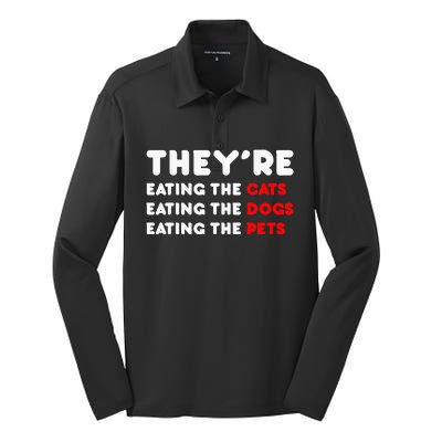 They Are Eating The Dogs Silk Touch Performance Long Sleeve Polo