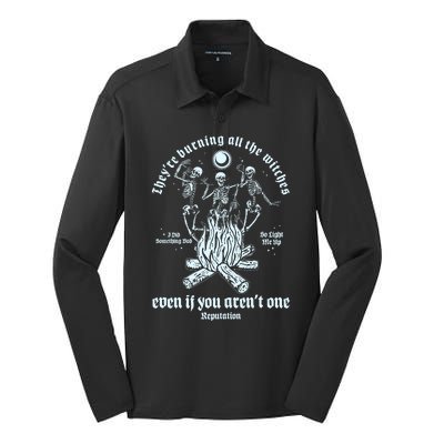 TheyRe Burning All The Witches Even If You ArenT One Dancing Skeletons Silk Touch Performance Long Sleeve Polo