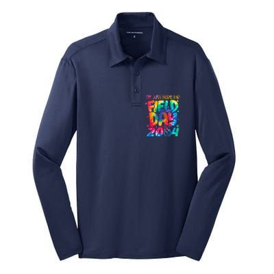 Tie Dye Just Here For Field Day 2024 Peace Sign Teacher Silk Touch Performance Long Sleeve Polo