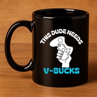 This Dude Needs V Bucks Funny This Dude Gamers Gift 11oz C Handle Ceramic Mug