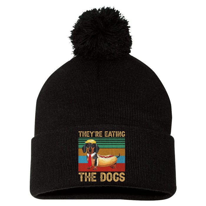 They’Re Eating The Dogs 2024 Retro Funny Dachshund Weiner Gift Pom Pom 12in Knit Beanie