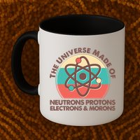 The Universe Made Of Neutrons Protons Electrons Morons Mug