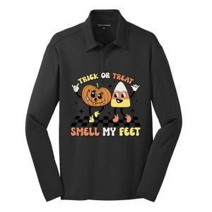 Trick Or Treat Smell My Feet Pumpkin Halloween Gift Silk Touch Performance Long Sleeve Polo