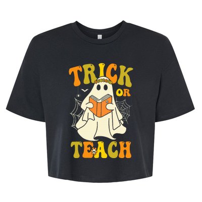 Trick Or Teach Groovy Halloween Retro Floral Ghost Teacher Bella+Canvas Jersey Crop Tee