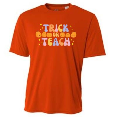 Trick or Teach Retro Groovy Pumpkin Teacher Halloween Cute T Cooling Performance Crew T-Shirt