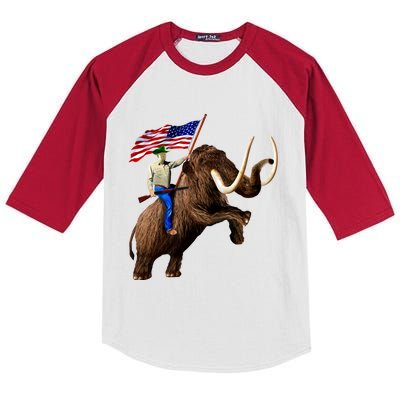 Trump Riding Mammoth Holding A Gun With Usa Flag Funny Gift Kids Colorblock Raglan Jersey