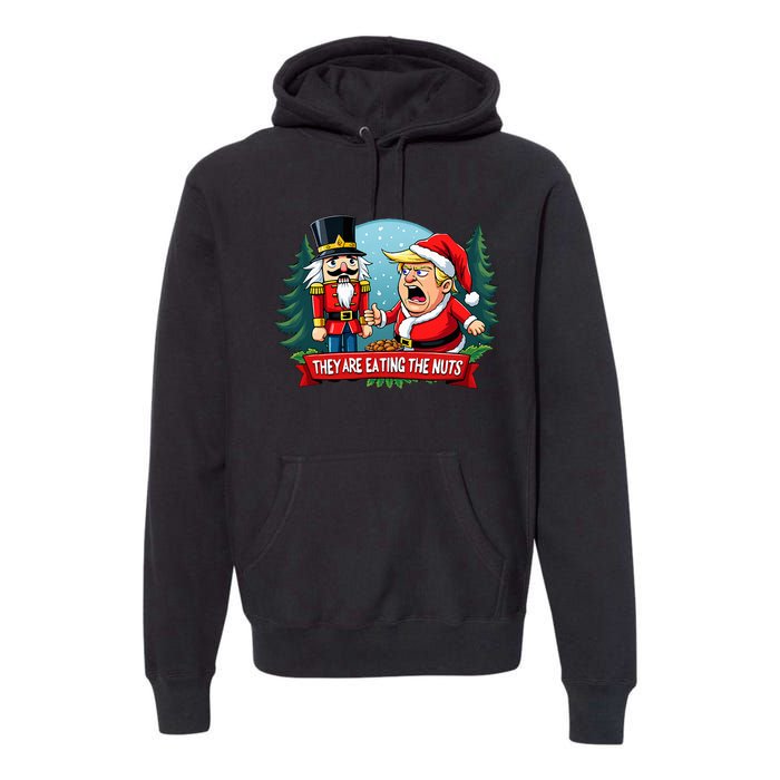 Trump Santa Claus With Nutcracker They Are Eating The Nuts Premium Hoodie