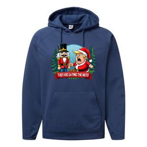 Trump Santa Claus With Nutcracker They Are Eating The Nuts Performance Fleece Hoodie