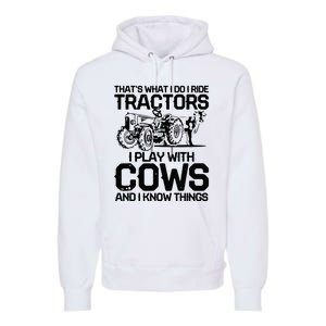 that's what i do i ride tractors i play with cows and i know Premium Hoodie