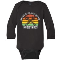 That´s What I Do, I Fix Stuff And I Know Things Baby Long Sleeve Bodysuit