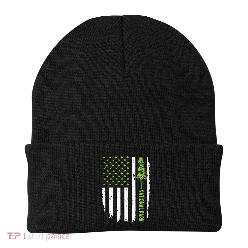 US american flag with pine tree for protect national parks  Beanie