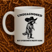 Undiagnosed But EveryoneS Pretty Sure Funny Cowboy Raccoon Mug