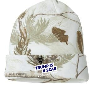 Uaw Union Trump Is A Scab Vote Kamala Harris Funny Uaw Red Kati Licensed 12" Camo Beanie