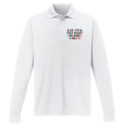 Very Merry Teacher Era Holiday Graphic Performance Long Sleeve Polo