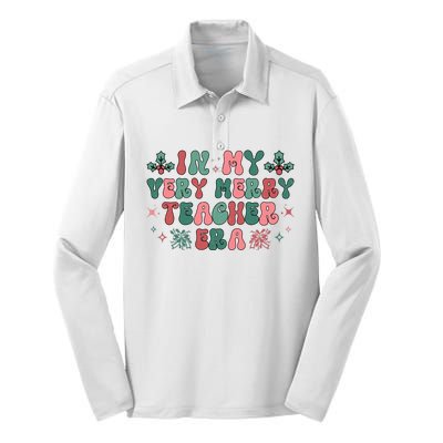 Very Merry Teacher Era Holiday Graphic Silk Touch Performance Long Sleeve Polo