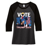 Vote Trump 2024 Fist Pump Never Surrender Fighter Women's Tri-Blend 3/4-Sleeve Raglan Shirt