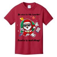 Wo Be Nice To The Teacher. Santa Is Watching! A Fun Christmas Kids T-Shirt