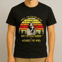 Well I’m Older Now But I’m Still Running Against The Wind T-Shirt