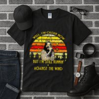 Well I’m Older Now But I’m Still Running Against The Wind Tall T-Shirt