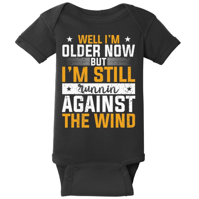 Well I’m Older Now But I’m Still Running Against The Wind Baby Bodysuit