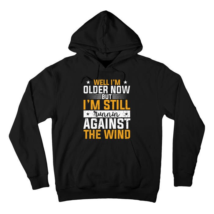 Well I’m Older Now But I’m Still Running Against The Wind Tall Hoodie