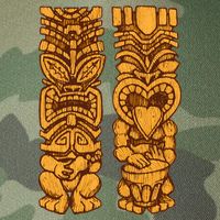 Wooden statues of Tiki with ukulele and drum Legacy Tie Dye Trucker Hat
