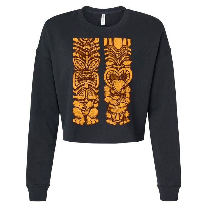 Wooden statues of Tiki with ukulele and drum Cropped Pullover Crew