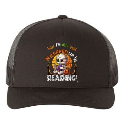 Wrapped Up In Reading Halloween Moon Cute Mummy Reading Book Yupoong Adult 5-Panel Trucker Hat