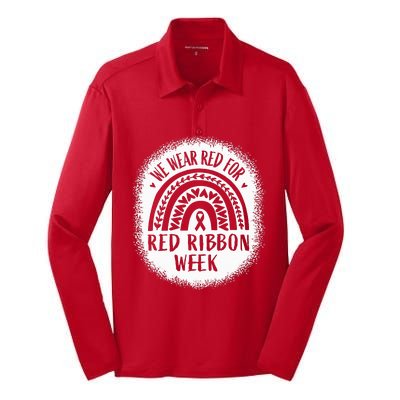 We Wear Red For Red Ribbon Week Awareness Silk Touch Performance Long Sleeve Polo