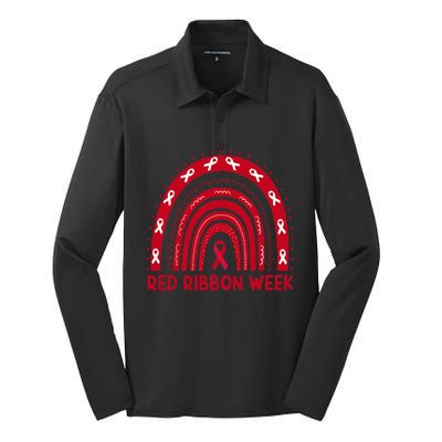 We Wear Red For Red Ribbon Week Awareness Red Rainbow Silk Touch Performance Long Sleeve Polo